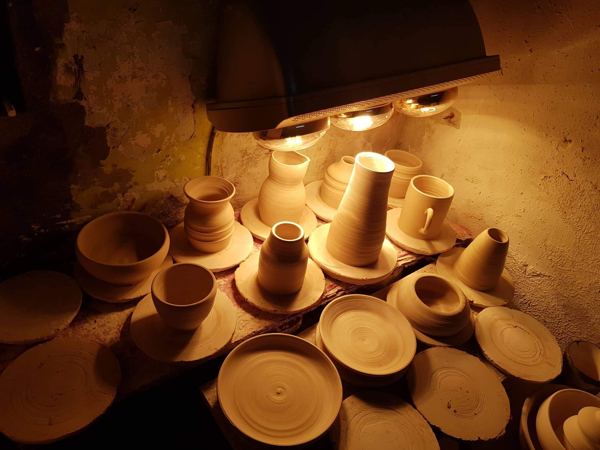 13 different items , bowls, mug ( with 2 handles) sakai bottle, vase , plates.